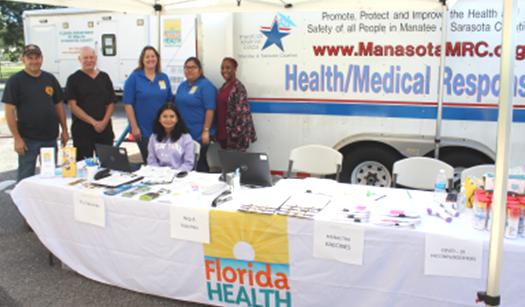 Manasota Medical Response Corps team under tent at info table