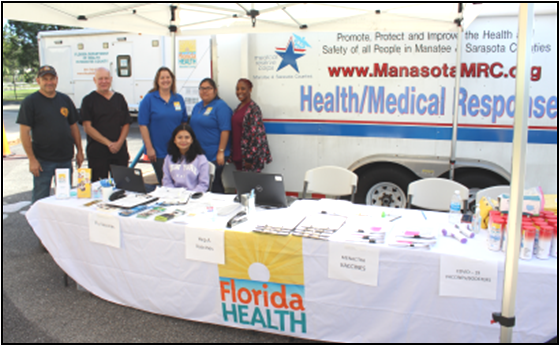 Manasota Medical Response Corps team under tent at info table